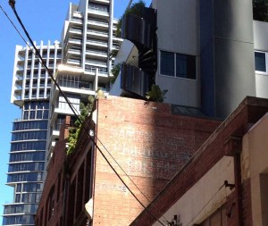 Roof garden with outside spiral staircase leading to it.
